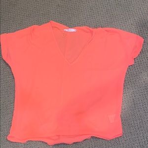 Bright orange-peach top